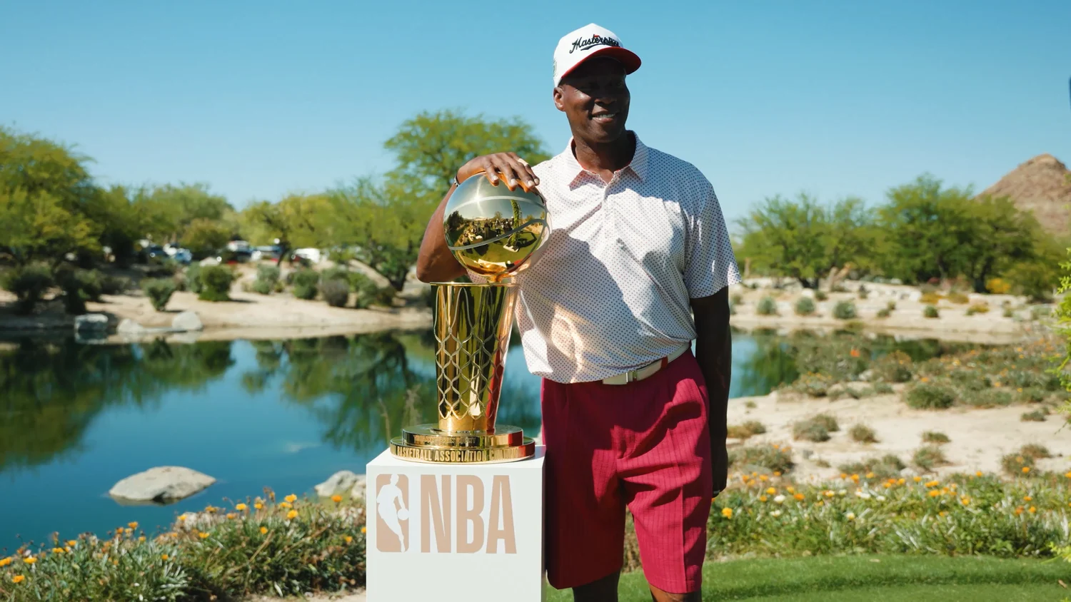 Studio 47 shooting at golden hour beside a championship trophy