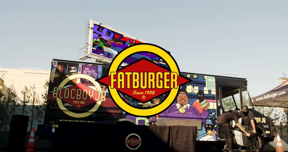 Branded truck and crew at an outdoor brand event
